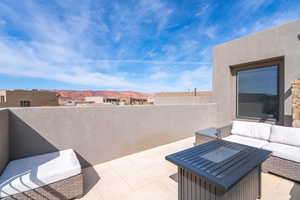 View of patio / terrace with a mountain view and outdoor lounge area