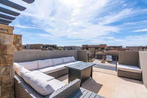 View of patio featuring an outdoor hangout area