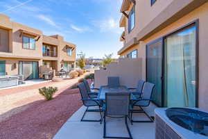 View of patio with central AC unit and grilling area