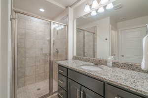 Bathroom featuring vanity and walk in shower