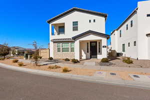 View of front of home with central air condition unit