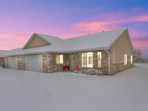 View of front of home featuring a garage