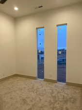 Unfurnished room featuring carpet floors