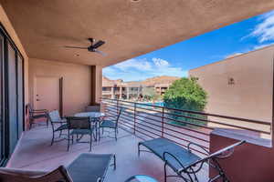 Balcony featuring ceiling fan and a mountain view