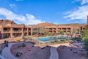 View of swimming pool with a mountain view