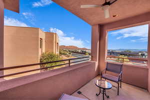 Balcony with a mountain view and ceiling fan