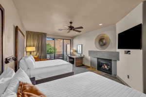 Carpeted bedroom with ceiling fan