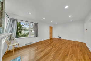 Spare room with light wood-type flooring