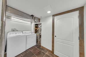 Laundry area with washer and clothes dryer