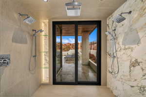 Doorway featuring expansive windows and tile patterned floors