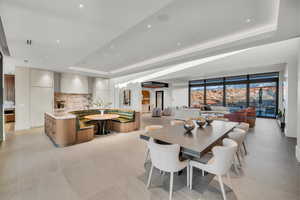 Dining room with a raised ceiling and recessed lighting