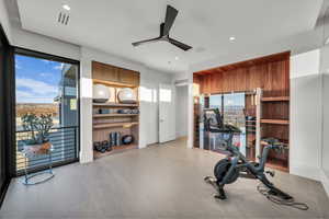 Exercise area featuring a ceiling fan and recessed lighting