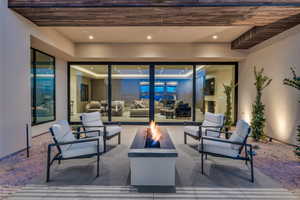 View of patio / terrace featuring an outdoor living space with a fire pit