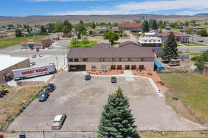 Birds eye view of property with a mountain view