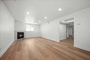 Unfurnished living room with light hardwood / wood-style flooring