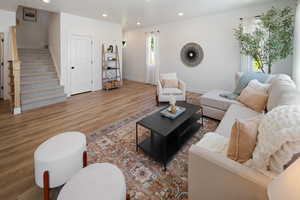 Living room with hardwood / wood-style floors