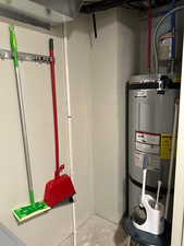 Utility room featuring electric water heater