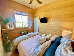 Bedroom with wooden walls