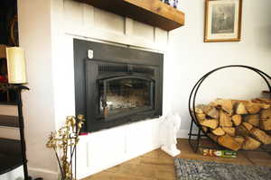 Featuring wood burning fireplace, tile / wood-style flooring