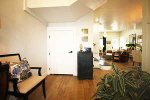 Foyer entrance with wood-tile flooring