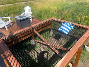 Wooden terrace featuring an outdoor fire pit. Basking Net featuring a mountain view ready for Star Gazing, Bird Watching, Wetland Viewing