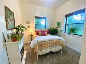 Bedroom 2 with light colored carpet and windows to soak in the views.