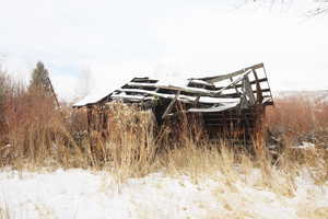 View of snow covered old homestead