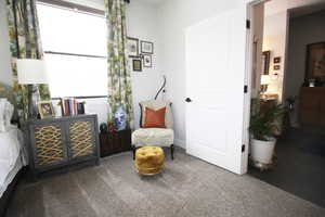 Sitting room in Main Bedroom featuring carpet flooring