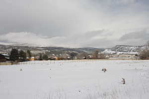 Snowy landscape with a mountain view  and Fenced for Livestock