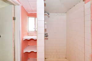 Bathroom featuring tiled shower