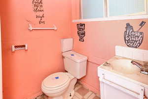 Bathroom featuring vanity and toilet