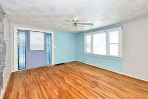 Unfurnished room featuring light hardwood / wood-style flooring and ceiling fan