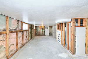 Interior space featuring a textured ceiling