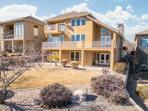 Back of property featuring a patio and french doors