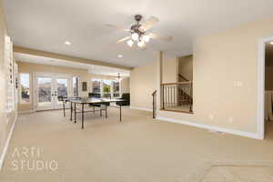 Playroom with french doors, light colored carpet, and ceiling fan