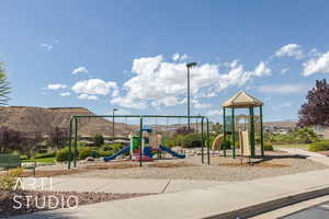 View of playground featuring a mountain view