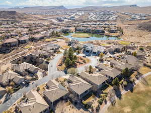 Drone / aerial view featuring a water and mountain view