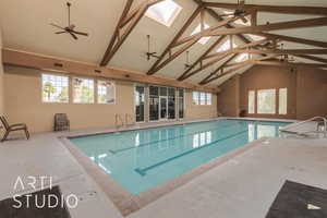 View of swimming pool with a skylight