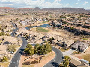 Drone / aerial view featuring a water and mountain view