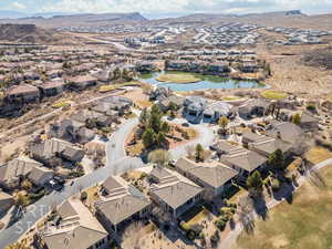 Drone / aerial view featuring a water and mountain view