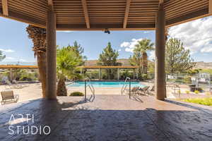 View of patio featuring a community pool