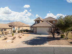 View of front of property featuring a garage