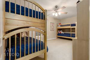 Unfurnished bedroom featuring carpet flooring and ceiling fan