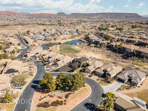 Drone / aerial view with a water and mountain view