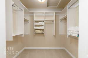 Spacious closet featuring carpet floors