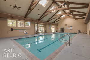 View of pool with a skylight