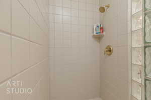 Bathroom with tiled shower