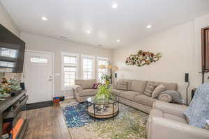 Living room featuring dark hardwood / wood-style flooring