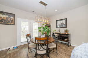 Dining room with dark wood-type flooring