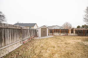 View of yard with a storage shed